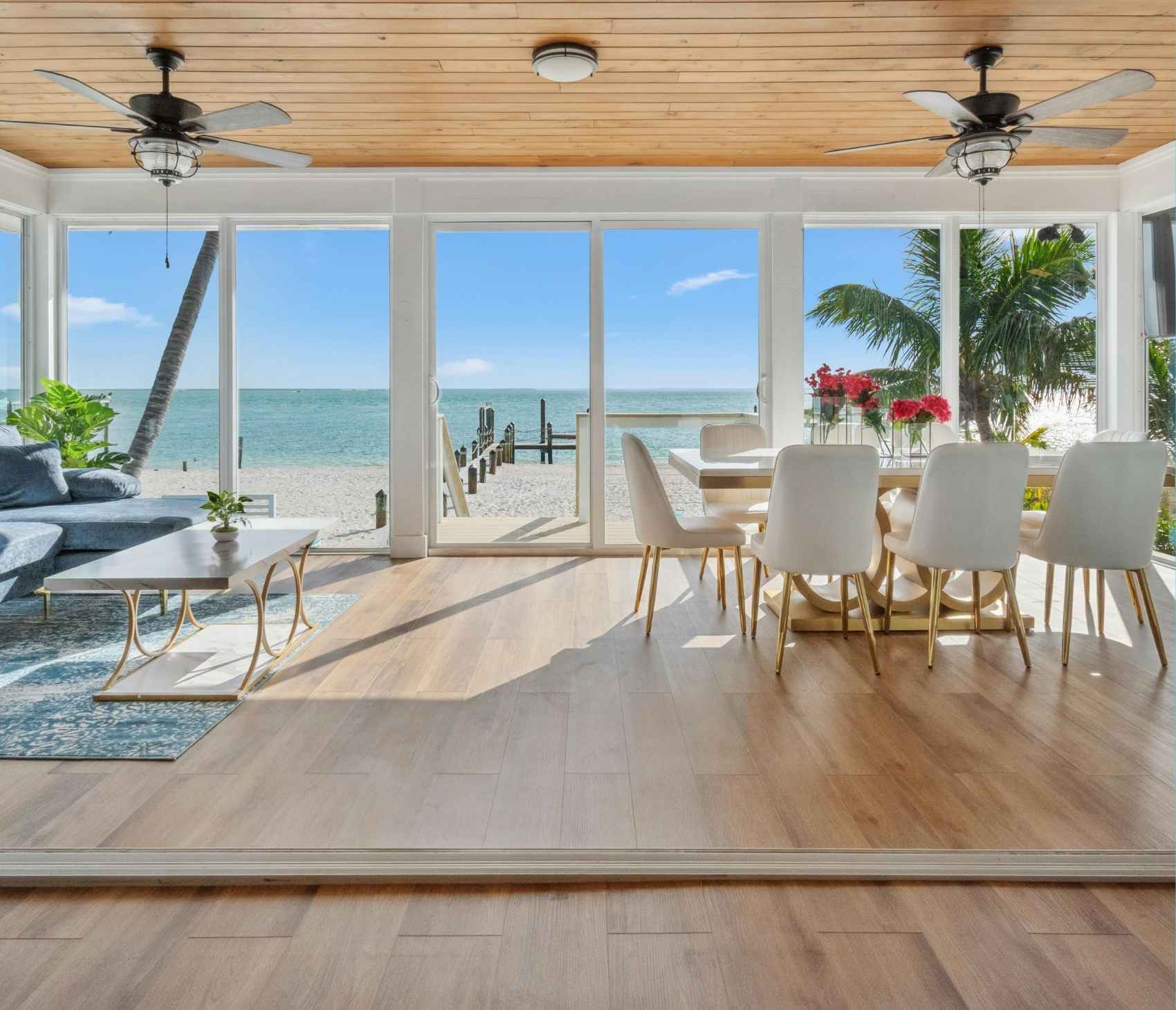 Coastal kitchen design with natural light and white cabinetry